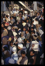 Egypt, Luxor, View looking down on crowds of Egyptians on a ferry.