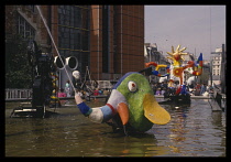 France, Ile de France, Paris, Pompidou Centre, Exterior with colourful artwork incorporating fountains.