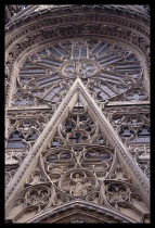 France, Normandy, Seine-Maritime, Rouen, Detail of stonework and window on the Cathedral exterior.