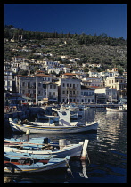 Greece, Peloponese Islands, Githion, Harbour with moored fishing boats overlooked by town houses. .