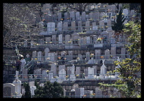 China, Hong Kong, Religion, Families visit graves during Qing Ming festival for the worship of ancestors.