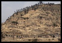 China, Shaanxi, Yanan, Cave houses carved into the loess soil of a hill.