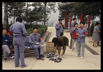 China, Yanan, Chinese tourists dressing up as Red Guards or Communists, at a tourist site.