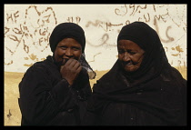 Egypt, Aswan, Portrait of two Nubian women in tradional dress.