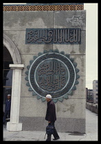 China, Yinchuan, Muslim man on his way to Mosque.