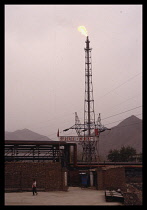 CHINA, Lanzhou, Oil Refinery with burn off and polluted sky.