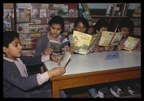 Egypt, Cairo, Childrens studying in library at state school.