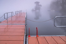 Ireland, County Sligo, Sligo town, Doorly Park, Boardwalk on the River Garavogue on a foggy winter morning.