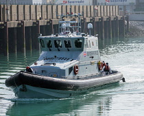 England, Kent, Dover, Border Force officers landing Asylum Seekers picked up in the English Channel.