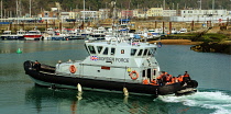 England, Kent, Dover, Border Force officers landing Asylum Seekers picked up in the English Channel.