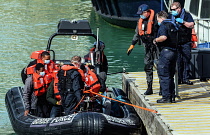 England, Kent, Dover, Border Force officers landing Asylum Seekers picked up in the English Channel.