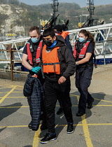 England, Kent, Dover, Border Force officers landing Asylum Seekers picked up in the English Channel.