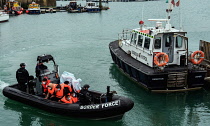 England, Kent, Dover, Border Force officers landing Asylum Seekers picked up in the English Channel.