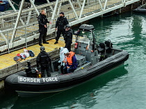 England, Kent, Dover, Border Force officers landing Asylum Seekers picked up in the English Channel.