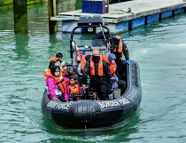 England, Kent, Dover, Border Force officers landing Asylum Seekers picked up in the English Channel.