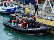 England, Kent, Dover, Border Force officers landing Asylum Seekers picked up in the English Channel.