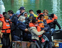 England, Kent, Dover, Border Force officers landing Asylum Seekrs picked up in the English Channel.