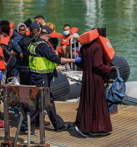 England, Kent, Dover, Border Force officers landing Asylum Seekrs picked up in the English Channel.