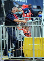 England, Kent, Dover, Border Force officers landing Asylum Seekers picked up in the English Channel.