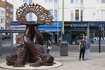 England, East Sussex, Brighton, Norfolk Square, Waves of Compassion Sculpture created by Steve Geliot, formed of three original Old Steine dolphins, which were designed by Amon Henry Wilds as part of...