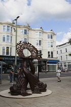 England, East Sussex, Brighton, Norfolk Square, Waves of Compassion Sculpture created by Steve Geliot, formed of three original Old Steine dolphins, which were designed by Amon Henry Wilds as part of...