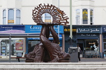 England, East Sussex, Brighton, Norfolk Square, Waves of Compassion Sculpture created by Steve Geliot, formed of three original Old Steine dolphins, which were designed by Amon Henry Wilds as part of...