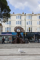 England, East Sussex, Brighton, Norfolk Square, Waves of Compassion Sculpture created by Steve Geliot, formed of three original Old Steine dolphins, which were designed by Amon Henry Wilds as part of...