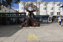 England, East Sussex, Brighton, Norfolk Square, Waves of Compassion Sculpture created by Steve Geliot, formed of three original Old Steine dolphins, which were designed by Amon Henry Wilds as part of...