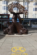 England, East Sussex, Brighton, Norfolk Square, Waves of Compassion Sculpture created by Steve Geliot, formed of three original Old Steine dolphins, which were designed by Amon Henry Wilds as part of...