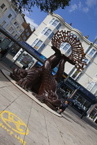 England, East Sussex, Brighton, Norfolk Square, Waves of Compassion Sculpture created by Steve Geliot, formed of three original Old Steine dolphins, which were designed by Amon Henry Wilds as part of...