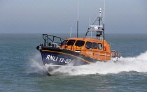 England, Kent, Dungeness, RNLI Lifeboat speeding towards land.