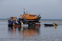 England, Kent, Dungeness, RNLI land crew bringing in the lifeboat.