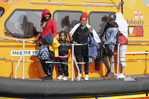 England, Kent, Dungeness, RNLI, helping migrants who have crossed the channel onto the beach, Susina 5yrs old and traveled with her mum from Eritrea.