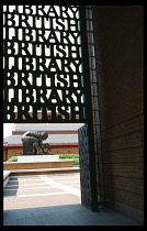 Education, Library, Exterior, The British Library in London. View towards courtyard statue from under carved  repeated name sign.