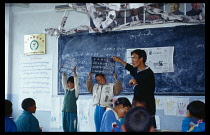 China, Tibet, Shigatse, Teacher at workshop to improve teaching skills.