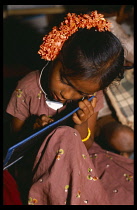 India, Andra Pradesh, General, School girl writing on a slate.