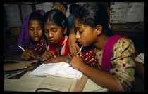 Bangladesh, Dhaka, Three girls at school in slum area.