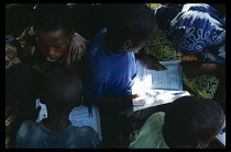 Somalia, Habare Village, Children using new textbooks published by Unicef.