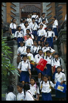 Indonesia, Bali, Ubud, Children in uniform leaving school.