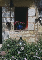 France, Loire, Les Maisons Trogladytes de Forges, Old Style cottage window detail.