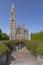 Ireland, County Roscommon, Roscommon town, The Roman Catholic Sacred Heart Church with a sunken grotto in the foreground.