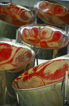 West Indies, Tobago, General, Steel drums with red reflections.