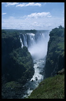 Zimbabwe, Victoria Falls, Distant view of the Zambezi River plunging into gorge in October during period of low water.