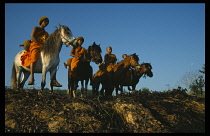 Thailand, Wat Phra Acha Tong, Novice Buddhist monks from The Golden Horse Forest Monastery travelling by horse to collect alms and preach the evils of amphetamines or Ya Ba.