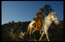 Thailand, Wat Phra Acha Tong, Novice Buddhist monks from The Golden Horse Forest Monastery  riding out to collect alms and preach the evils of amphetamines or Ya Ba.