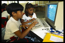 Mexico, Puebla, Primary school children learning computer skills.