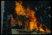 Indonesia, Bali, Ubud, Cremation ritual.  Burning sarcophagus in the form of a bull  tradition believes that the body within returns to earthly elements and its soul is released in the sparks.