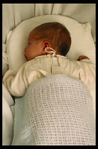 Children, New Born Babies, One week old baby lying on front in cot.