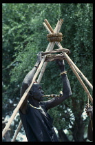 Sudan, Dinka, Dinka tribesman building framework for roof of hut.