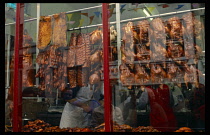 England, London, Chinatown, Peking duck hanging in window of Chinese restaurant.